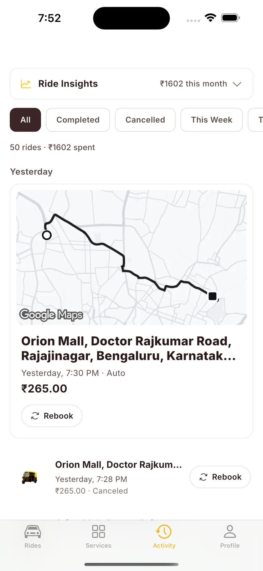 Activity tab with Ride Insights: ₹1,602 this month across 50 rides, with one-tap Rebook.